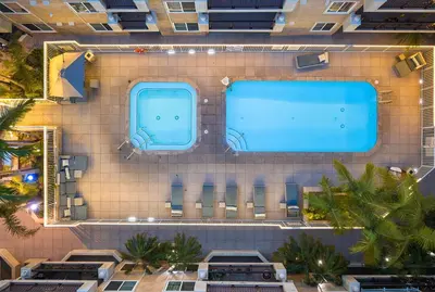 an overhead view of a building with two swimming pools at Admiralty 2BD Luxe Retreat with FREE PARKING in Los Angeles