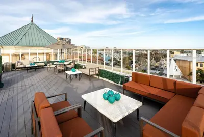 a patio with couches and tables on a roof at Admiralty 2BD Luxe Retreat with FREE PARKING in Los Angeles