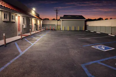 a parking lot with blue lines in a building at Carlton Motel in Los Angeles