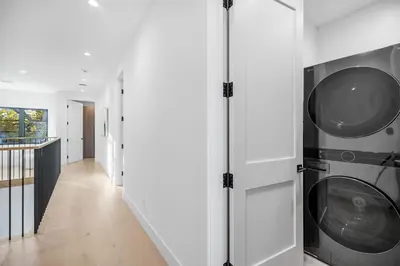 a laundry room with two washer and dryer at Colfax Estate in Los Angeles