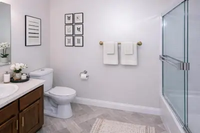 a white bathroom with a toilet and a shower at Evera Residence- 1Bed with Free Parking, Pool and Sauna in Los Angeles