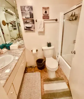 a bathroom with a toilet and a sink at Sweet 2 bedrooms home by the beach city in Los Angeles