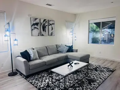 a living room with a couch and a coffee table at Stylish & Fully Renovated Home! in Oxnard