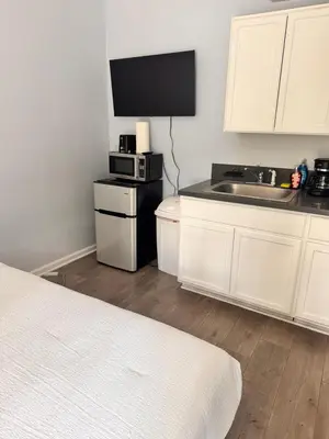 a room with a kitchen with a microwave and a sink at Cozy Studio, Studio City Unit 3 in Los Angeles