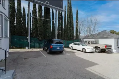 a car and a truck parked in a parking lot at Cozy Studio, Studio City Unit 3 in Los Angeles