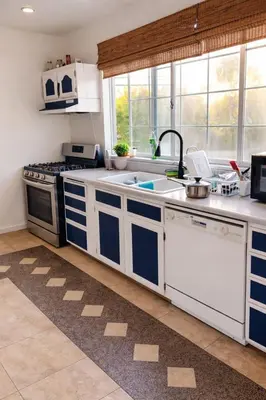 a kitchen with a sink and a stove at Robertson Homes of Love in Los Angeles
