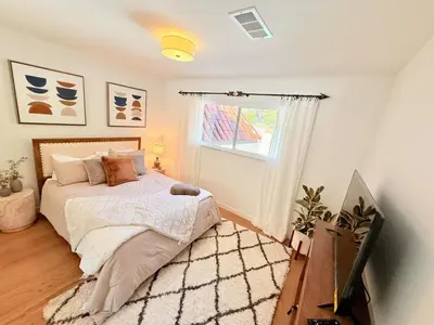 a bedroom with a bed and a window at Lavender House - Serene Ojai Retreat, Pool, Orchard in Ojai