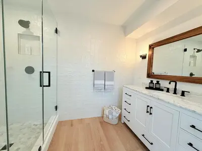 a bathroom with a shower and a sink and a mirror at Lavender House - Serene Ojai Retreat, Pool, Orchard in Ojai