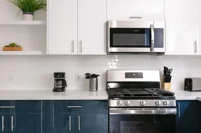a kitchen with a stove and a microwave at Central LA Escape Near Universal & Beaches in Los Angeles