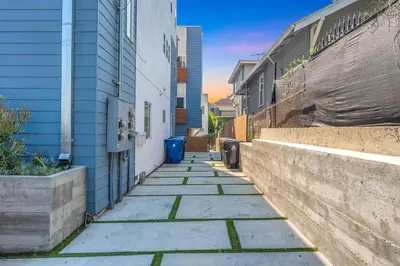 a sidewalk next to a building and a wall at Central LA Escape Near Universal & Beaches in Los Angeles