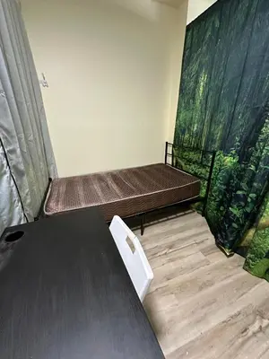 a room with two beds and a table at Shared room, Prime Location LA in Los Angeles