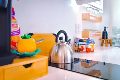 a tea kettle on a counter in a kitchen at The Sycamore Suite in Santa Clarita