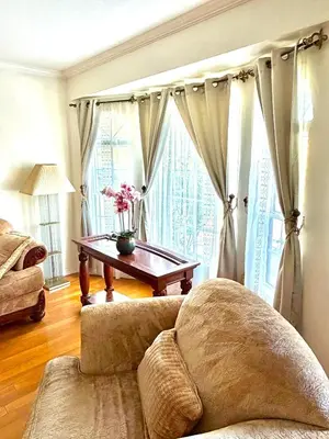 a living room with a couch and a table at Dream House Retreat LLC in Los Angeles