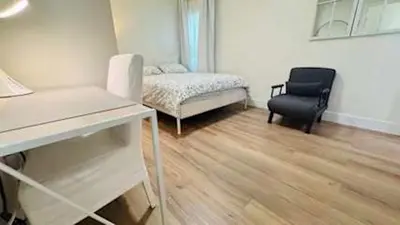 a room with a bed and a desk and a chair at Charming 2B2B Retreat in Temple City in Temple City