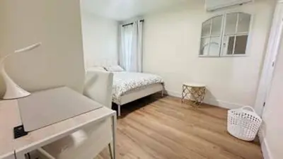 a white room with a bed and a desk at Charming 2B2B Retreat in Temple City in Temple City