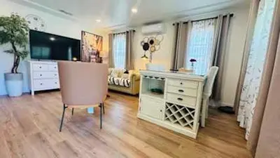 a room with a desk and a chair and a bedroom at Charming 2B2B Retreat in Temple City in Temple City