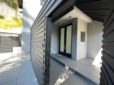 a door on the side of a house at Hollywood Hills Luxury Nest Views Pool Spa in Los Angeles
