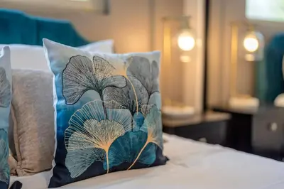 a pillow sitting on top of a bed at Near LLU Hospital Calm 3BR Workspace in Loma Linda