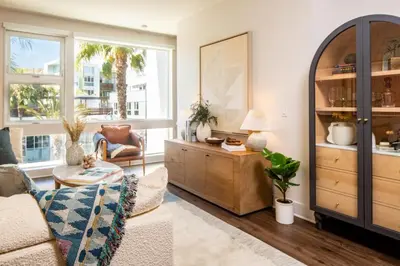 a living room with a couch and a table at Runway Playa Vista in Los Angeles