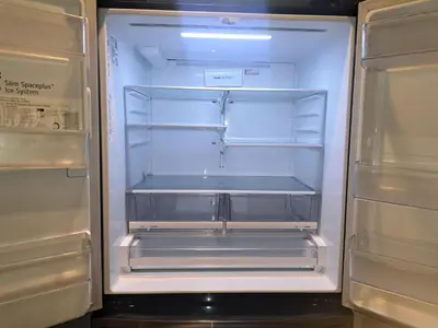 an empty refrigerator with its door open in a kitchen at Amazing 3 bedrooms with 3 bedroom apt in the center of Beverly Hills in Los Angeles