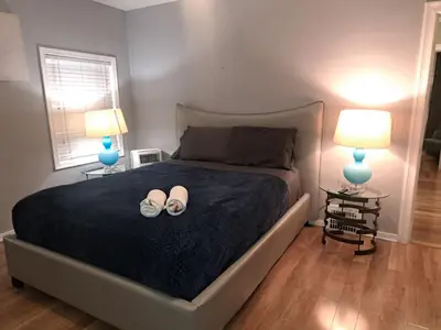 a bedroom with a bed with two lamps and two shoes on it at Amazing 3 bedrooms with 3 bedroom apt in the center of Beverly Hills in Los Angeles