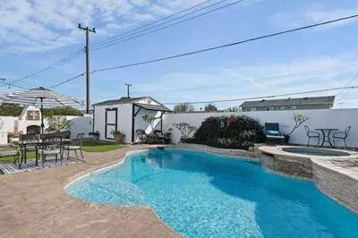 a swimming pool in the backyard of a house at Peace of Paradise - Heated Pool, Spa & Fireplace in Simi Valley