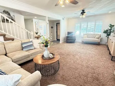 a living room with a couch and a table at Peace of Paradise - Heated Pool, Spa & Fireplace in Simi Valley