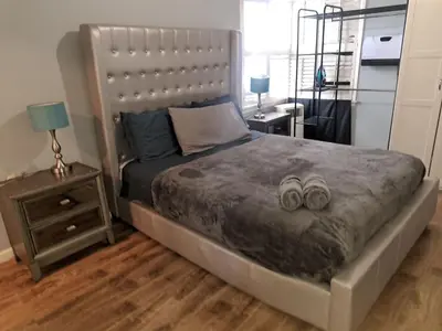 a bedroom with a bed with two wedding rings on it at Charming 1 bedroom apt in Beverly Hills in Los Angeles