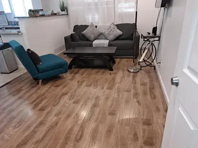 a living room with a couch and a chair at Charming 1 bedroom apt in Beverly Hills in Los Angeles
