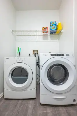 a washing machine and a washer in a room at Newly Remodeled 2BR Apt | Mins to Disney | Arcade in Placentia