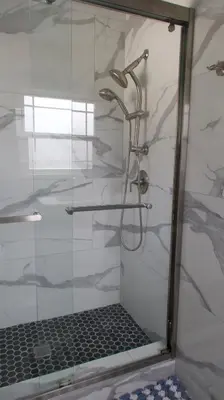 a shower in a bathroom with a glass door at Luxury Pool Oasis- Near Stadium, Tennis and Golf in Pasadena
