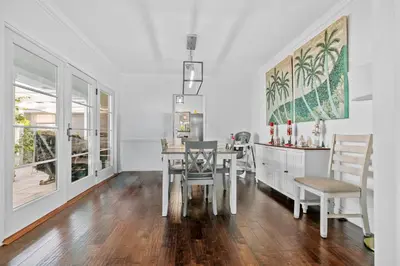 a dining room with a table and two chairs at Luxury Pool Oasis- Near Stadium, Tennis and Golf in Pasadena