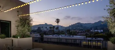 a balcony with a view of the mountains at Snazzy 3BR Apt Hollywood with Pool & Spa in Los Angeles