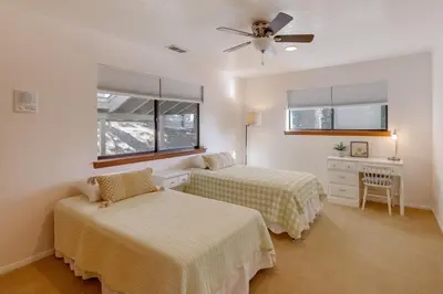 a bedroom with two beds and a ceiling fan at Mtn and Valley Views! Rimforest Lodge with Fireplace in Rimforest