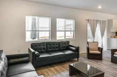 a living room with a couch and a table at Pet-Friendly Yard! Family Home in Bakersfield in Bakersfield