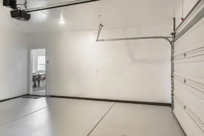 an empty room with a white wall and a basketball hoop at Pet-Friendly Yard! Family Home in Bakersfield in Bakersfield