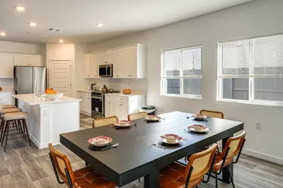 a kitchen and dining room with a table and chairs at Pet-Friendly Yard! Family Home in Bakersfield in Bakersfield