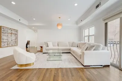 a living room with a white couch and two white chairs at Los Angeles Beverly Hills Westside UCLA Luxury in Los Angeles