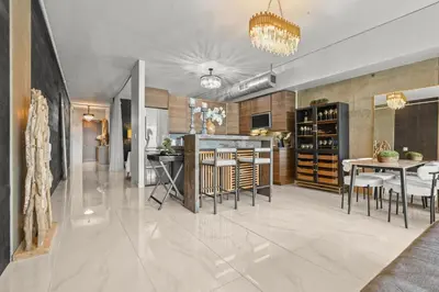 a kitchen and living room with a dining room at Luxe DTLA Escape - Walk to Games, Events, & Dining in Los Angeles