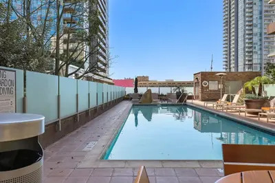 a swimming pool on the side of a building at Luxe DTLA Escape - Walk to Games, Events, & Dining in Los Angeles