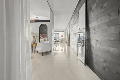 a hallway with a dining room and a living room at Luxe DTLA Escape - Walk to Games, Events, & Dining in Los Angeles