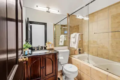 a bathroom with a toilet and a sink and a tub at Hillside Retreat Near Universal Studios & Hollywood Sign in Los Angeles
