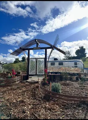 a train station with a train on a track at Zaromelranch