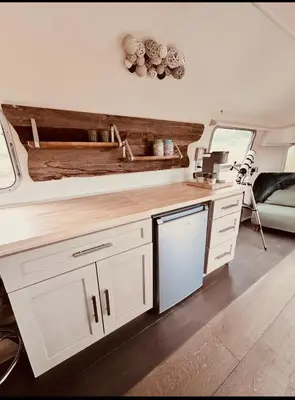 a kitchen in an rv with a sink at Zaromelranch