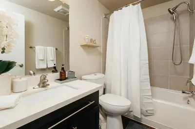 a bathroom with a sink and a toilet and a shower at Upscale 1BD - Prime West Hollywood Location in Los Angeles