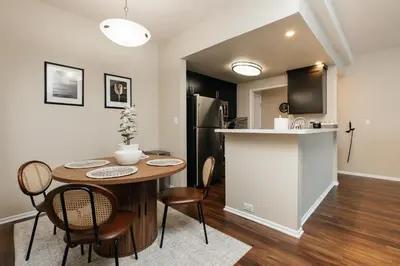 a kitchen and dining room with a table and chairs at Upscale 1BD - Prime West Hollywood Location in Los Angeles