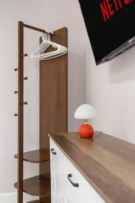 an orange lamp sitting on a desk in a room at Sleek Premium Studio Near The Grove & Fairfax in Los Angeles