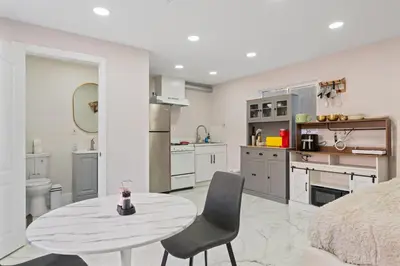 a kitchen with a table and chairs in a room at Sleek Premium Studio Near The Grove & Fairfax in Los Angeles