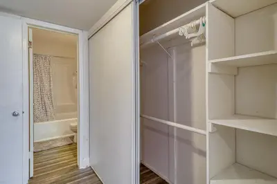 a bathroom with a walk in closet and a toilet at Extended Stay in the Valley Gated and Convenient! in Tarzana