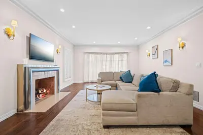 a living room with a couch and a fireplace at Spacious 5BR LA Villa with Pool Spa & Game Room in Los Angeles